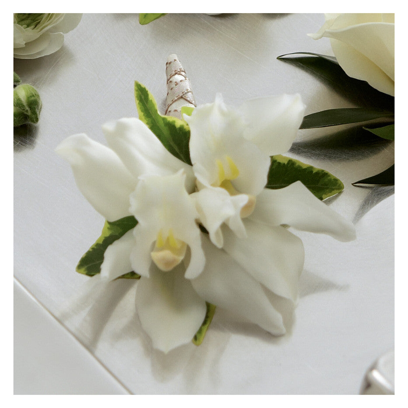 White Mini Cymbidium Boutonniere